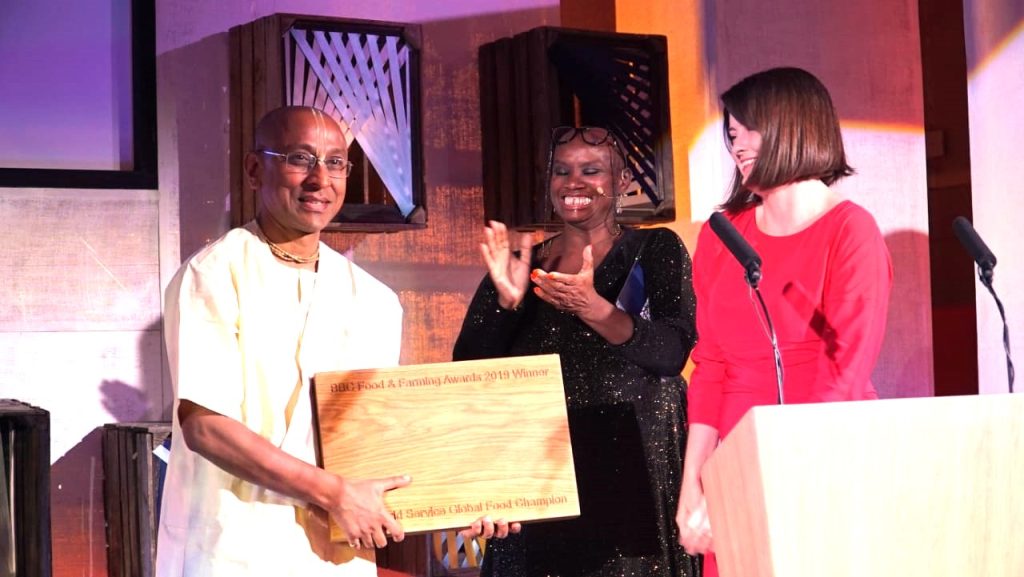 Akshaya Patra representative receiving the BBC World Service Global Food Champion Award on stage