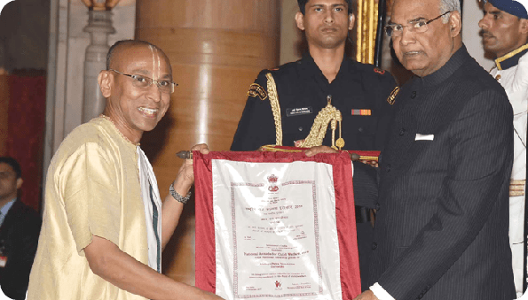 Recipient receiving the National Award for Child Welfare from the former President of India, Shri Ram Nath Kovind